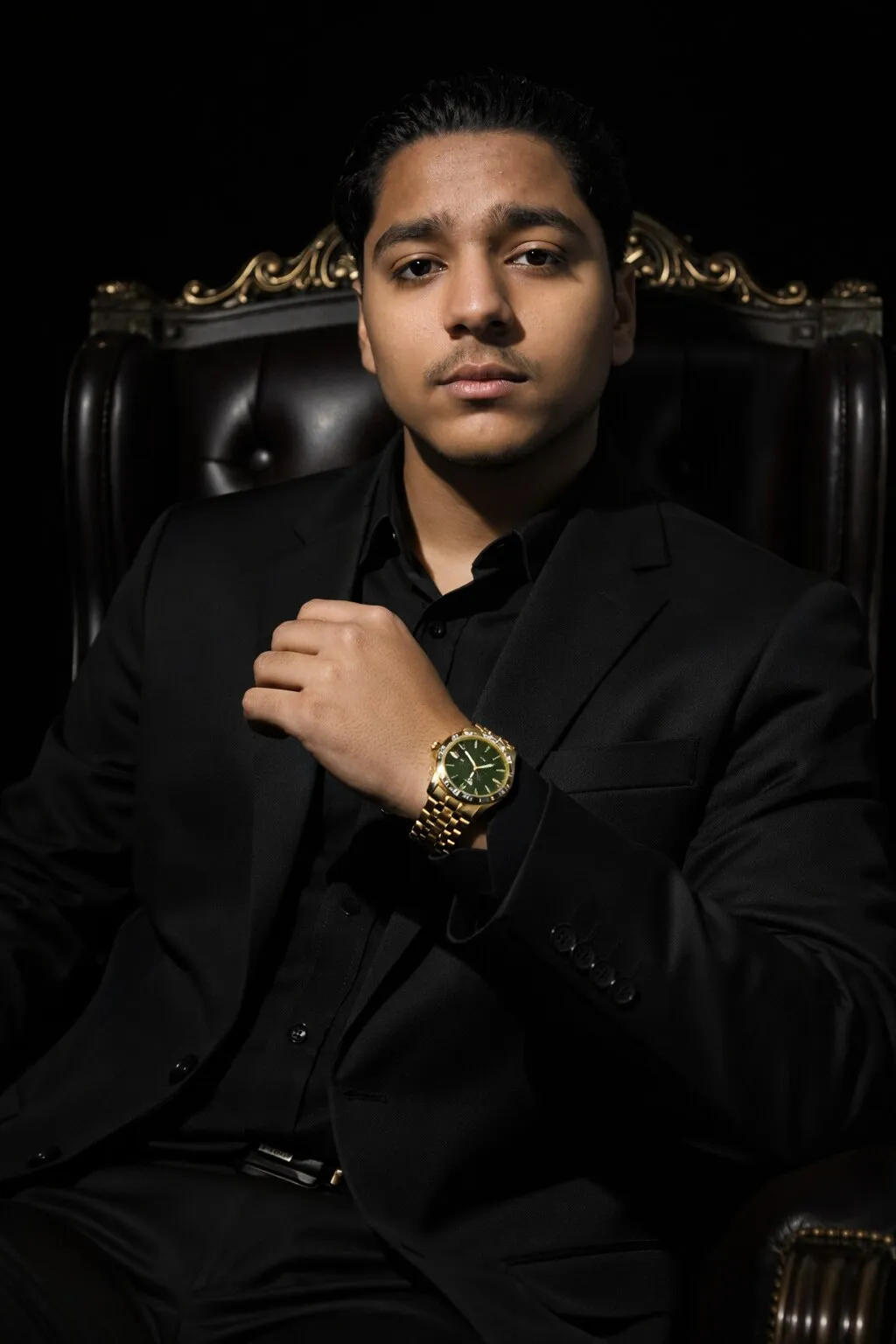 Ammar Haris Munnee, CEO of Antique Accessories, seated in a black suit in Dubai
